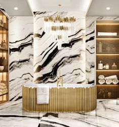 a marble bathroom with gold accents and chandelier above the bathtub is surrounded by shelving