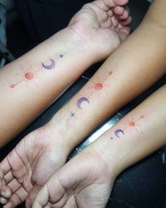 two people with matching tattoos on their arms