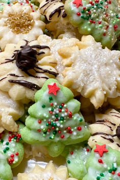 A plate of Spritz Christmas cookies. Cookie Spritz Recipes, The Best Spritz Cookie Recipe, Pressed Cookies Christmas, Icing For Spritz Cookies, How To Make Spritz Cookies, Chai Spritz Cookies, Dairy Free Spritz Cookies, Jello Spritz Cookies, Recipe For Cookie Press Cookies