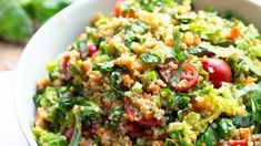 a white bowl filled with lots of veggies