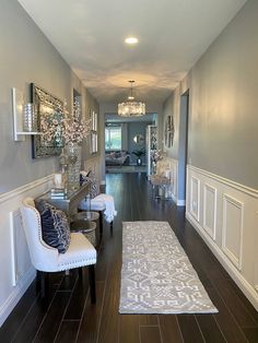 the hallway is clean and ready for guests to use it as an entrance way in this home