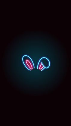 an image of two ears in the dark with neon lights on it's side