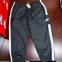 Nike Womens Black Sportswear Standard Fit Mid Rise Woven Track Pants Size Xxl Brand: Nike Department: Womens Size: Xxl Color: Black Type: Pants Style: Track Pants Pattern: Solid Theme: Sports Occasion: Activewear Season: All Season Features: Elastic Waist, Pockets Condition: New With Tags I Offer Discounts For All Return Customers. - Jvs Black Nylon Sports Bottoms, Black Bottoms With Elastic Waistband For Sports, Nike Black Joggers For Jogging, Nike Black Athleisure Sweatpants, Nike Black Sportswear Joggers, Sporty Black Moisture-wicking Bottoms, Black Sportswear Activewear With Elastic Waistband, Casual Nylon Tracksuit For Streetwear, Black Activewear With Elastic Waistband