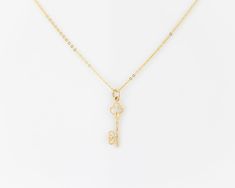 "\"KAYANA\" real vintage, 14k solid gold, dainty minimalist skeleton key pendant (on a complimentary gold plated sterling silver chain). The pendant features two interwoven hearts at the end of the key. We have two of these in stock that are identical, they go well together as a matching set- grab em while they're still available! (Just add two to cart- if only one is available then the other one has sold.) More necklaces: https://dvnejewelryco.etsy.com SIMILARLY: dainty gold plated sterling sil Elegant Sterling Silver Key Jewelry, Elegant Sterling Silver Key Necklace, Elegant Key Pendant Necklace, Classic Jewelry With Keys For Gifts, Gold Key Pendant Jewelry, Yellow Gold Key Pendant Jewelry, Gold Pendant Jewelry With Keys, Elegant Two Keys Necklace As Gift, Elegant Two Keys Necklace Gift