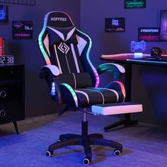 a gaming chair sitting in front of a computer desk with neon lights on the back