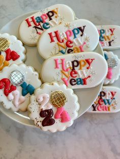 happy new year decorated cookies on a plate