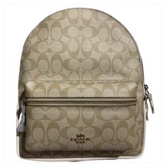 Coach Medium Charlie Backpack In Signature Canvas Luxury Beige Backpack With Adjustable Strap, Luxury Beige Backpack Bag, Designer Beige Backpack For Travel, Classic Beige Rectangular Backpack, Luxury Beige Backpack, Classic Beige Backpack Bag, Classic Beige Leather Rectangular Backpack, Luxury Beige Leather Satchel Backpack, Designer Beige Backpack For Daily Use