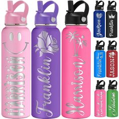 four water bottles with different designs and colors on them, one is pink, the other is blue