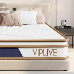 an image of a bed that is made up with the word vilve on it