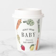 a paper cup with the words locally grown baby written on it and illustrations of vegetables