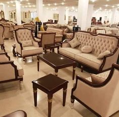 a room filled with lots of couches and chairs