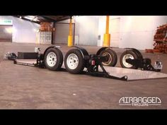 a flatbed trailer parked in an empty warehouse