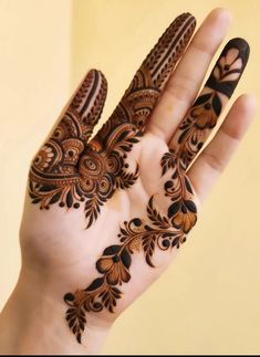 a person's hand with hennap on it, showing the intricate design