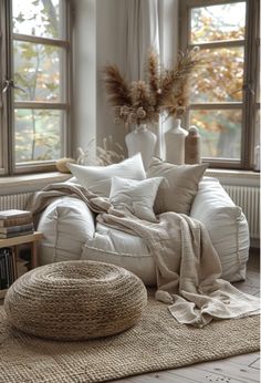 a living room filled with furniture and windows