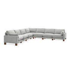 a grey sectional couch with wooden legs on an isolated white background, viewed from the front