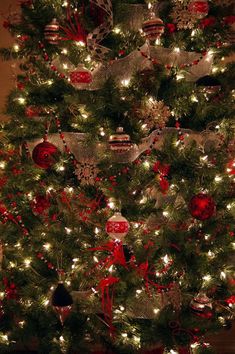 a christmas tree decorated with red and silver ornaments