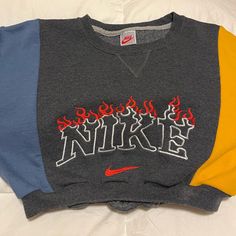 One Of A Kind Vintage Cropped Nike Sweater. Tri Color With Unique Flame Embroidery. Never Worn. Flame Embroidery, Cropped Nike, Nike Crewneck, Nike Sweaters, Nike Sweater, Vintage Nike, Cropped Sweater, Tri Color, Blue Orange