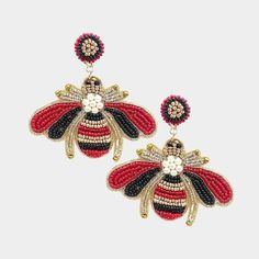 Honey Bee Red & Black Seed Bead Dangle Earrings by Treasure Jewelry Item: Pierced Earrings Vendor: Treasure Jewelry Size: 2.75" X 2.75"(Inches) Color: Black, Red Metal: Alloy, Lead & Nickle Free Material: Seed Beads, Felt Back, Faux Pearls, Rhinestones Theme: Honey Bee All Measurements Are Approximate. Sold As One Pair Of Earrings Honey Bee Earrings, Masks Halloween, Bridal Headbands, Southwest Boho, Drag Queen Makeup, Bead Dangle Earrings, Treasure Jewelry, Queen Makeup, Ear Muffs