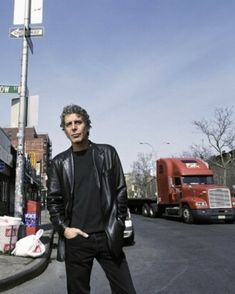 a man is standing on the street corner