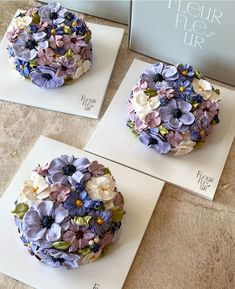 there are three cakes that have flowers on them