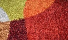 an area rug with different colors and shapes