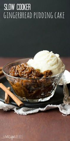 a glass bowl filled with ice cream and cinnamon crumbs on top of a wooden table