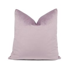 a lavender colored pillow on a white background