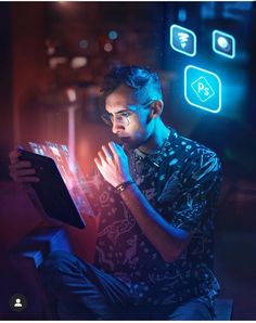 a man sitting in front of a laptop computer