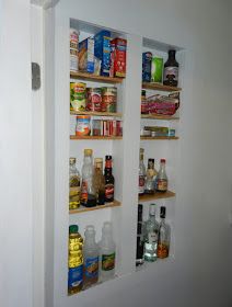 an open pantry door with shelves filled with food and condiments