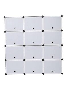 a white and black wall mounted display unit with six rows of squares on each side