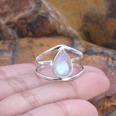 Elevate your style with our stunning Rainbow Moonstone ring. This handcrafted beauty features a mesmerizing Rainbow Moonstone set in a splendid sterling silver ring. *Captivating Colors: The Rainbow Moonstone's iridescent play of colours adds a touch of magic to your look. Each stone is carefully chosen for its unique charm. *Celestial Charm: The sterling silver moonstone setting adds a celestial touch, showcasing the moonstone in an elegant and timeless design. *Handcrafted Beauty: made by skilled artisans, each ring is a work of art that brings a special touch to your style. *Versatile Elegance: Whether for special occasions or everyday wear, this Moonstone ring is a versatile piece that adds a hint of mystique to any outfit. *Perfect Fit: Available in various sizes, ensuring a comfortab Silver Teardrop Stackable Rings, Silver Stackable Teardrop Rings, Pear-shaped Moonstone Gemstone Ring, Silver Pear-shaped Moonstone Ring, Anniversary Teardrop Natural Stone Ring, Rough Rose Quartz, Beauty Features, Black Earrings Dangle, Doll Jewelry