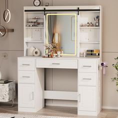 a white desk with drawers and a mirror on it's shelf next to a plant