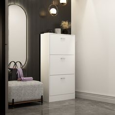 a white chest of drawers sitting next to a wall mounted mirror in a living room