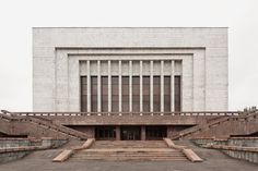 an empty building with steps leading up to it