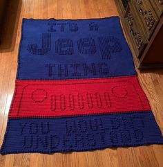 a crocheted rug with the words good times written on it in red and blue