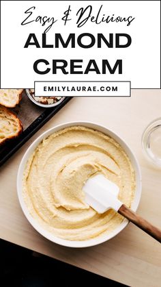 a white bowl filled with almond cream next to toasted bread