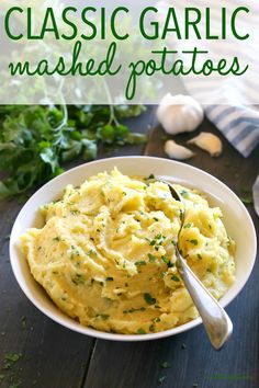 a bowl filled with mashed potatoes and garnished with parsley on the side