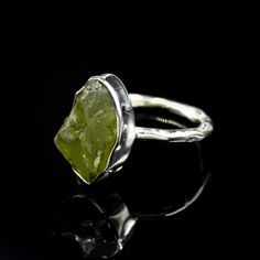 Peridot Rough Ring, 925 Sterling Silver Ring For Women,  Gems Ring, Handmade Ring, Christmas Gift, Gift for Wife, Minimalist Ring, Bridesmaid Gift, Ring for Her, Wedding Ring, Handmade Ring For Women, Engagement Ring Statement Ring Gemstone Name : Peridot Rough  Gemstone  Purity: 925 Parts Per 1000 Metal :  925 Sterling Silver  Ring Size :  All Size Available Weight : 4.0gm approx. Our products are totally handmade and made with high-quality gemstones and sterling silver.  Elevate your style with this stunning raw peridot ring, set in premium sterling silver. The natural peridot crystal's organic shape and vibrant green color make it a unique statement piece, perfect for everyday wear or special occasions. 🌿 Raw Peridot Gemstone: A beautiful, uncut peridot crystal, cherished for its natur Peridot Rings With Natural Stones For Gifts, Elegant Peridot Crystal Ring Gift, Raw Peridot Ring, Green Peridot Crystal Ring, Nature-inspired Peridot Rings As Gift, Rough Ring, Silver Ring For Women, Peridot Crystal, Raw Gemstone Ring