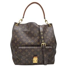 Expertly crafted and stylish, the Louis Vuitton 2014 Monogram Canvas Metis Hobo Bag is the perfect blend of fashion and function. Made with durable Monogram coated canvas and cowhide leather trim, this bag features an exterior flap pocket with a secure S-lock closure, as well as multiple interior pockets for organization. The adjustable handle allows for versatile carrying options, making it a must-have for any fashion-forward individual. Designer: Louis Vuitton Material: Monogram coated-canvas Upcycled Louis Vuitton Bag, Boho Louis Vuitton Handbags, Leather Trim, Hobo Bag, Flap Pocket, Monogram Canvas, Fashion Handbags, Leather Trims, Cowhide Leather