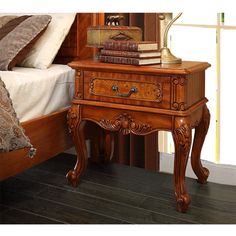 a bed with a wooden headboard and night stand