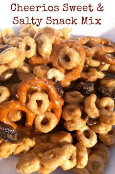 cheerios sweet and salty snack mix on a white plate with the title above it