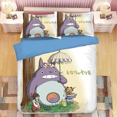 an image of a bed set with totoro and other things on the floor