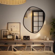 a table with chairs and a mirror on the wall