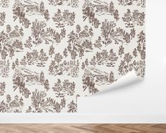 a wallpaper with trees on it and a white paper in the corner next to it