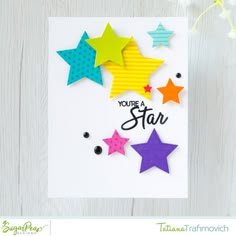 a card with colorful stars and the words you're a star on it