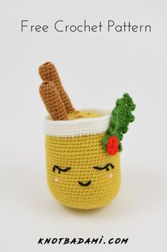 a crocheted mug with a face and a plant in it, on a white background text reads free crochet pattern