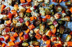 roasted vegetables on a baking sheet ready to be cooked