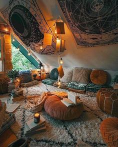 a living room filled with lots of furniture and books on top of carpeted flooring