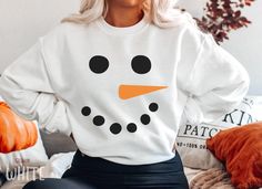 Funny Christmas Snowman Sweatshirt, Cute Family Matching Snowman Face Sweater For Women, Retro Vintage Xmas Holiday Party Crewneck Sweater HOW TO ORDER ➀ Select color ➁ Select the size (Please check size chart) ✦ True to size. Size up 1-2 sizes for an oversized look. ➂ Add to cart ✦ (Optional) "Add message to Seller" on the checkout page. GARMENT FEATURES ✦ Crew neckline ✦ Direct to garment printing - no vinyl, decal, or iron-on technique ✦ Our designs are printed on the garment to last a long time and may not appear as 'glossy' or saturated as iron-on designs are. ✦ Please note that colors may appear different on different digital screens and may not be a true representation of the actual colors. ✦ Additional T-Shirt Colors and Sizes Available Upon Request ✧✧Brands: Bella Canvas Unisex 30 White Winter Holiday T-shirt, Fun Winter T-shirt With Crew Neck, Fun Crew Neck Winter Sweatshirt, Fun Winter Crew Neck Sweatshirt, White Sweatshirt For Fall Holiday, Fun White Sweatshirt For Winter, White Long Sleeve Holiday Sweatshirt, Casual White Christmas Sweater, White Crew Neck Winter T-shirt