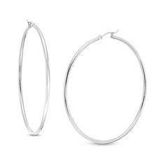 Simple and classic, these earrings are great for any daytime look. Fashioned in cool 14K white gold, these 2.0 x 60.0mm hoop earrings are finished with a bright finish. These earrings secure comfortably with latch backs. Classic Oval Sterling Silver Hoop Earrings, Classic Sterling Silver Tarnish Resistant Hoop Earrings, Classic Tarnish Resistant Sterling Silver Hoop Earrings, Classic White Gold Tarnish Resistant Hoop Earrings, Classic Tarnish Resistant White Gold Hoop Earrings, Classic White Gold Tarnish-resistant Hoop Earrings, Classic Sterling Silver Hoop Earrings, Classic Sterling Silver Hoop Earrings With Ear Wire, Minimalist Round Hoop Earrings With Shiny Finish